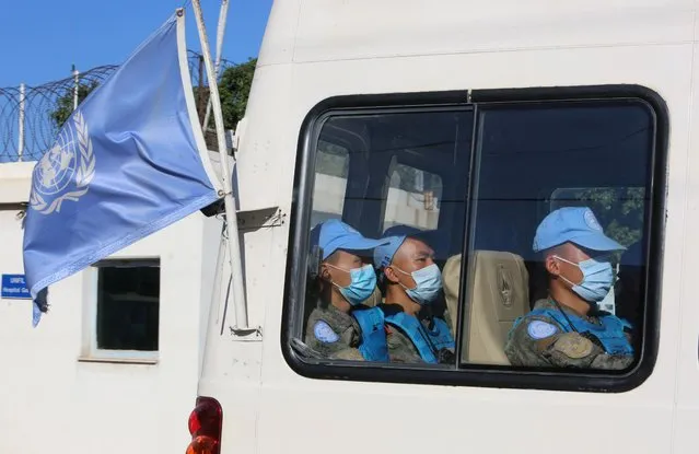 UN peacekeepers (UNIFIL) wear face masks as they ride in a vehicle in Naqoura, near the Lebanese-Israeli border, southern Lebanon on October 14, 2020. (Photo by Aziz Taher/Reuters)