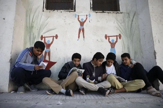 Yemeni pupils gather prior to a midterm exam at a public school in Sana'a, Yemen, 15 November 2022. Over four million school-aged children in Yemen need support to access education, as many families struggle to send their children to school because of the deteriorating economic situation in the war-ravaged country, according to UNICEF estimates. (Photo by Yahya Arhab/EPA/EFE/Rex Features/Shutterstock)