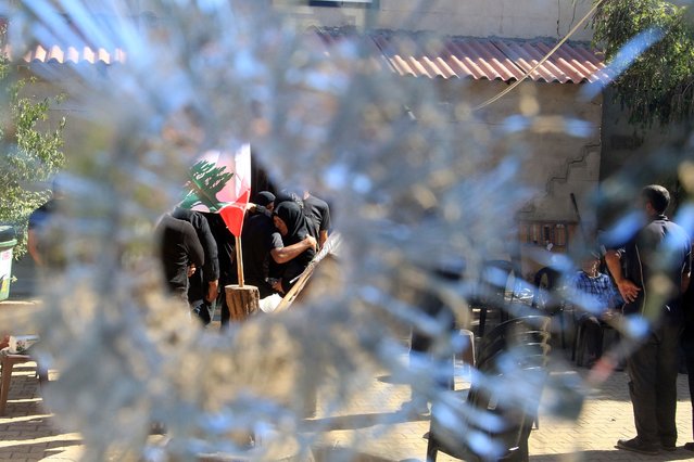 People gather outside the municipality building in the southern Lebanese border village of Blida in the aftermath of an Israeli army raid on the village, on October 30, 2025. The Israeli military on October 30 killed a municipal worker in a raid in southern Lebanon, prompting the Lebanese president to order the army to confront such incursions. Israel's military confirmed the raid, saying it was operating against Hezbollah infrastructure when its forces fired on a “suspect”. (Photo by Mahmoud Zayyat/AFP Photo)