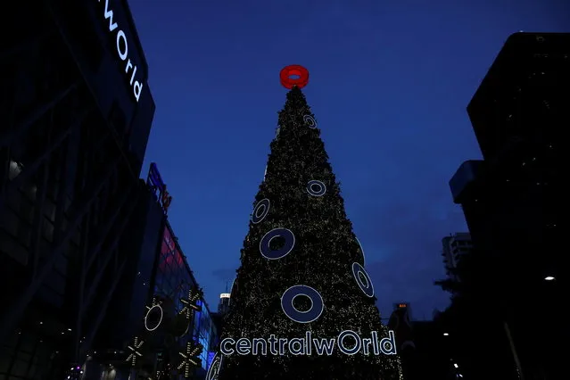 A decorated Christmas tree is seen in front of a shopping center in Bangkok, Thailand on December 24, 2020. (Photo by Soe Zeya Tun/Reuters)