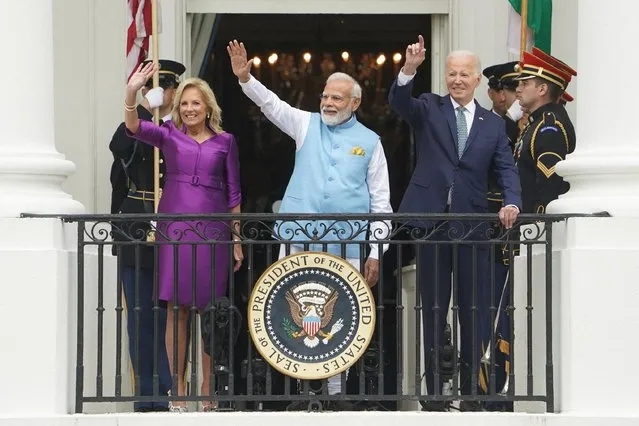 U.S. President Joe Biden, India's Prime Minister Narendra Modi and U.S. first lady Jill Biden wave during an official State Arrival Ceremony at the start of Modi's visit to the White House in Washington, U.S., June 22, 2023. (Photo by Kevin Lamarque/Reuters)