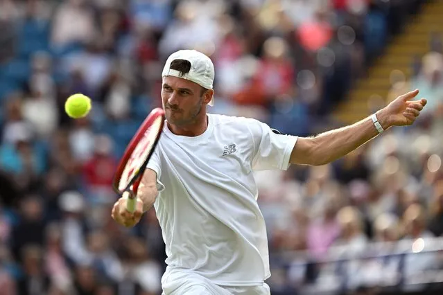 Tommy Paul of the United States plays a backhand during his singles match against J J Wolf of the United States at the Rothesay International Eastbourne at Devonshire Park on June 29, 2023 in Eastbourne, England. (Photo by Justin Setterfield/Getty Images)