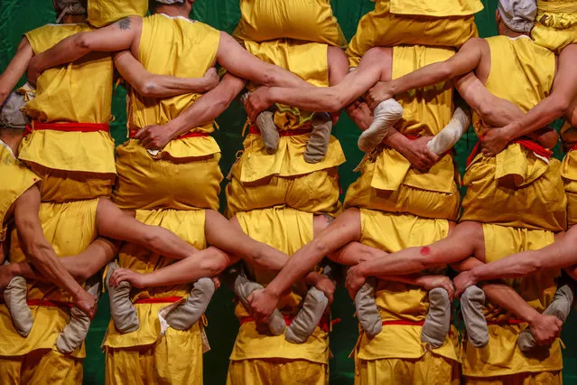 Photo shows the traditional folklore performance in Sanyang Town at She County, Huangshan City, east China's Anhui Province, 2 March 2021. Pictured “Human Tower” stunt. (Photo by Rex Features/Shutterstock)