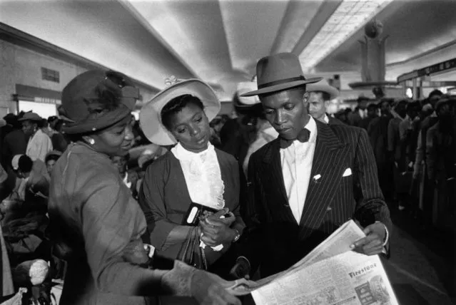 Newly arrived West Indian immigrants in the Customs Hall after their arrival at Southampton in England, 27th May 1956. (Photo by Haywood Magee/Picture Post/Getty Images)