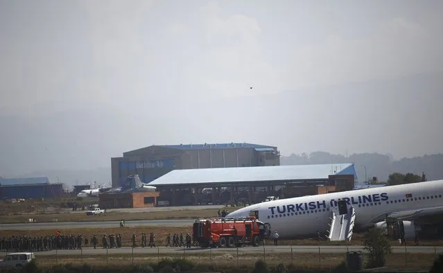A Turkish Airlines plane lies on the field after it overshot the runway at Tribhuvan International Airport in Kathmandu March 4, 2015. According to local media, all passengers were rescued. REUTERS/Navesh Chitrakar 