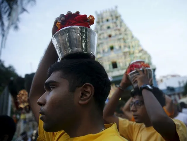 Devotees carrying milk pots leave the Sri Srinivasa Perumal Temple during Thaipusam festival in Singapore January 24, 2016. (Photo by Edgar Su/Reuters)