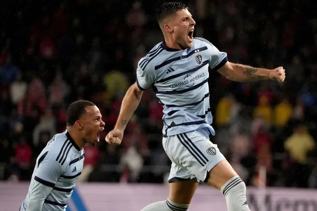 Sporting Kansas City midfielder Rémi Walter, right, and defender Logan Ndenbe celebrate after Walter scored a goal during the first half of an MLS playoff soccer match against St. Louis City Sunday, October 29, 2023, in St. Louis. (Photo by Jeff Roberson/AP Photo)