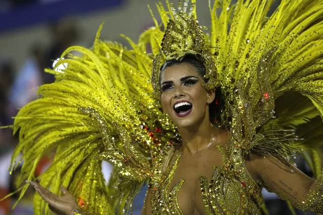 Drum queen Bianca Leao, from Uniao da Ilha samba school, dances during Carnival parade at the Sambadrome, in Rio de Janeiro, Brazil, Sunday, February 7, 2016. (Photo by Silvia Izquierdo/AP Photo)