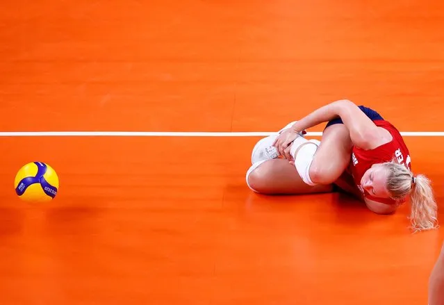 USA's Jordyn Poulter reacts after getting injured in the women's preliminary round pool B volleyball match between USA and Italy during the Tokyo 2020 Olympic Games at Ariake Arena in Tokyo on August 2, 2021. (Photo by Carlos Garcia Rawlins/Reuters)