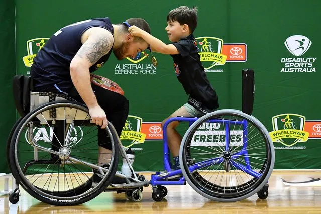 Nick Briant of Victoria Metro is presented with his premiership medal after winning the Division 1 Grand Final match between Victoria Metro and Western Australia during the 2023 Toyota AFL Wheelchair National Championships Grand Final Day at State Netball Hockey Centre in Melbourne, Australia on November 5, 2023. (Photo by Josh Chadwick/AFL Photos via Getty Images)