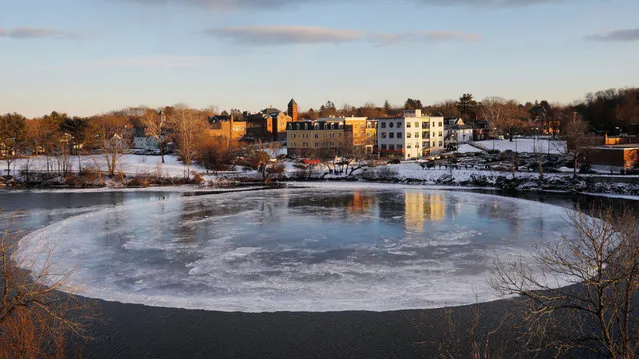 A large, circular ice floe spins slowly in the Presumpscot River in Westbrook, Maine, U.S., January 16, 2019. (Photo by Brian Snyder/Reuters)