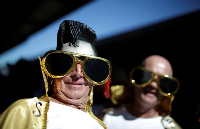 Elvis impersonators with plastic hair and oversized sunglasses arrive at  the 25th annual Parkes Elvis Festival in the rural Australian town of Parkes, west of Sydney, January 12, 2017. (Photo by Jason Reed/Reuters)