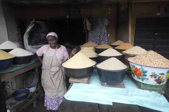A woman sell grains at a market in Lagos, Nigeria on Saturday, September 16, 2023. (Photo by Sunday Alamba/AP Photo)