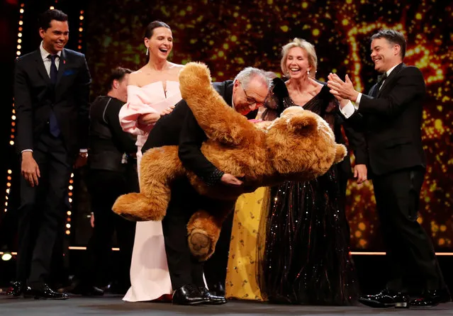 Festival director Dieter Kosslick recieves a bear from president of the International Jury Juliette Binoche, during the awards ceremony at the 69th Berlinale International Film Festival in Berlin, Germany, February 16, 2019. (Photo by Hannibal Hanschke/Reuters)