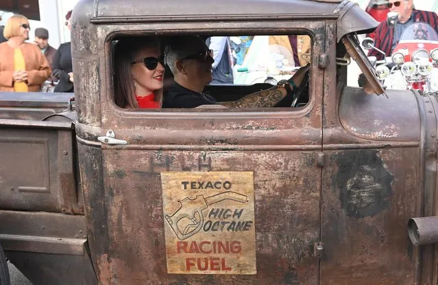 Motoring enthusiasts attend the Goodwood Revival, a three-day historic car racing festival in Goodwood, Chichester, southern Britain, September 17, 2021. (Photo by Toby Melville/Reuters)