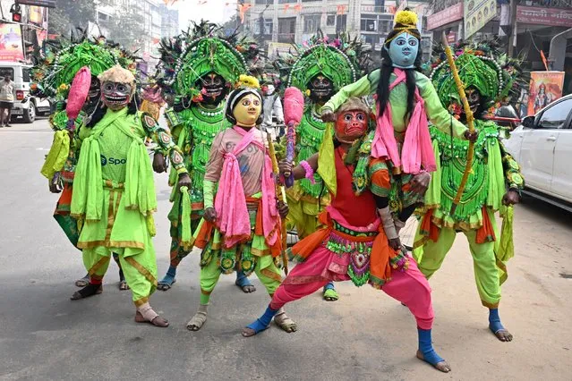 Traditional Chhau dancers dress in the guise of Hindu deities in Kolkata on January 22, 2024, on the occasion of Ayodhya Ram temple's consecration ceremony. (Photo by Dibyangshu Sarkar/AFP Photo)