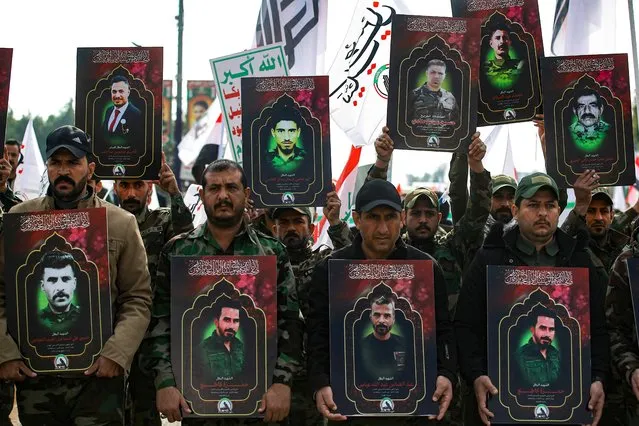 Members of Iraq's Hashed al-Shaabi (Popular Mobilisation), carry portraits of people  killed the previous day in US strikes in western Iraq, ahead of their funeral procession in Baghdad on January 4, 2024. Deadly US strikes on Iran-backed forces in Syria and Iraq drew sharp condemnation from the region, after President Joe Biden vowed further action in response to the killing of three US soldiers in Jordan on January 28. (Photo by Ahmad Al-Rubaye/AFP Photo)