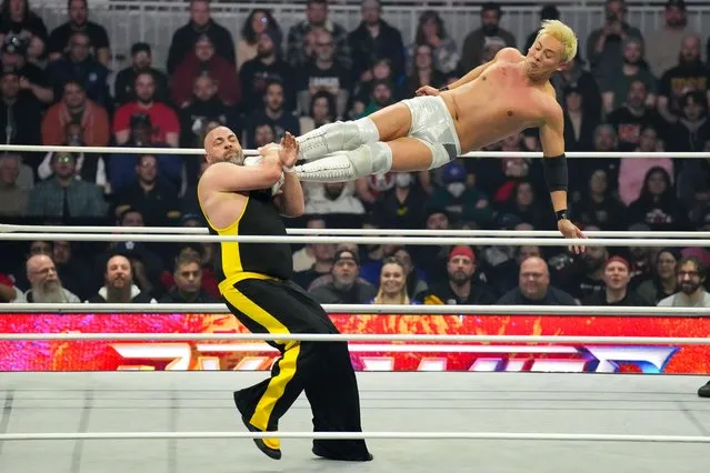 Japanese wrestler Kazuchika Okada, right, performs with Eddie Kingston during All Elite Wrestling's Dynamite/Rampage card in Toronto, on Wednesday, March 20, 2024. (Photo by Chris Young/The Canadian Press via AP Photo)