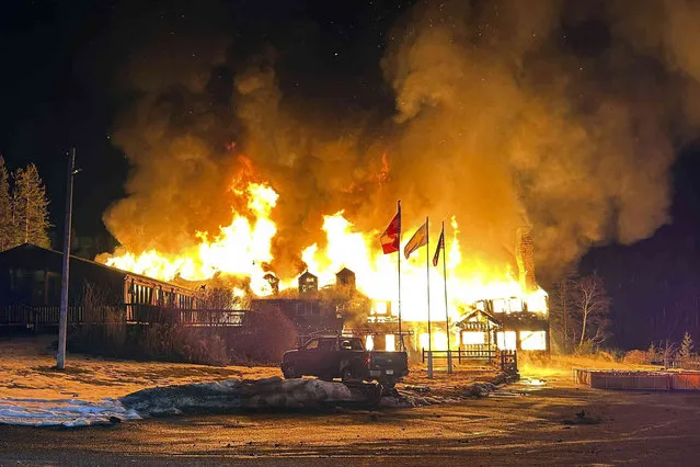 Smoke Flames engulf Lutsen Lodge as an overnight blaze destroyed the historic lodge, early Tuesday, February 6, 2024, in Lutsen, Minn. (Photo by Edward Vanegas via AP Photo)