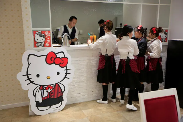 Employees prepare food for customers in China's first official Hello Kitty-themed restaurant in Shanghai, China, April 9, 2016. (Photo by Aly Song/Reuters)