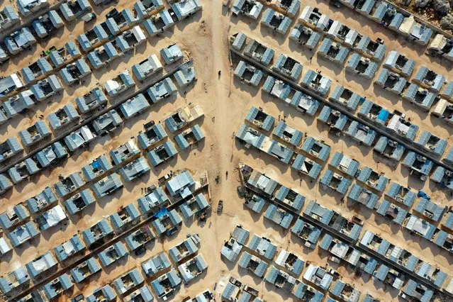 An aerial view shows shelters at the newly-established Watan camp for internally displaced people in the village of Kafr Jales in Syria's northwestern Idlib province, on November 17, 2021. (Photo by Omar Haj Kadour/AFP Photo)