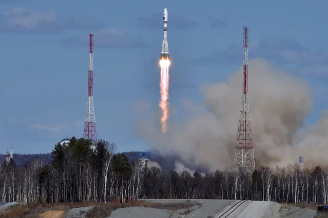 A Russian Soyuz 2.1a rocket carrying Lomonosov, Aist-2D and SamSat-218 satellites leaves a trail of smoke as it lifts off from the new Vostochny cosmodrome  outside the city of Uglegorsk, about 200 kilometers (125 miles)  from the city of Blagoveshchensk in the far eastern Amur region Thursday, April 28, 2016. (Photo by Kirill Kudryavtsev/Pool Photo via AP Photo)