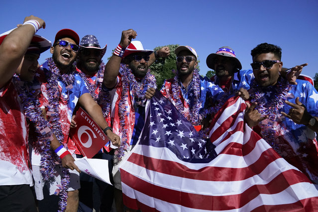 USA fans celebrate before the ICC men's Twenty20 World Cup 2024 group A cricket match between the USA and India outside Nassau County International Cricket Stadium in East Meadow, New York on June 12, 2024. (Photo by Timothy A. Clary/AFP Photo)