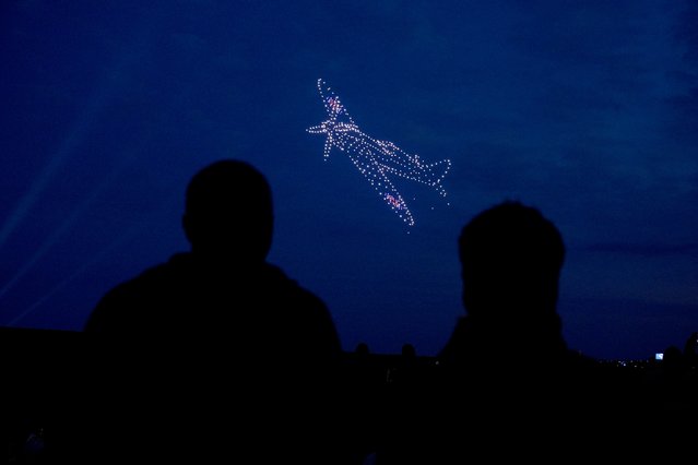 Drones make a Spitfire during a drone display telling the story of D-Day above the coastline in Portsmouth, Hampshire, at the end of the BBC broadcast of the Great Vigil, ahead of the 80th anniversary of D-Day on Wednesday, June 5, 2024. (Photo by Andrew Matthews/PA Images via Getty Images)