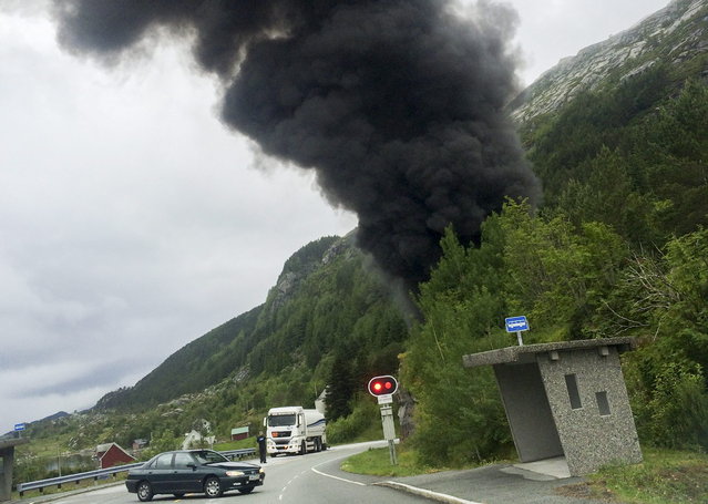 Smoke rises from the Skatestraum tunnel, after a gasoline trailer carrying around 16,000 liters of gasoline exploded inside the tunnel, in Bremanger, Norway July 15, 2015. (Photo by Daniel Restad/Reuters/NTB Scanpix)