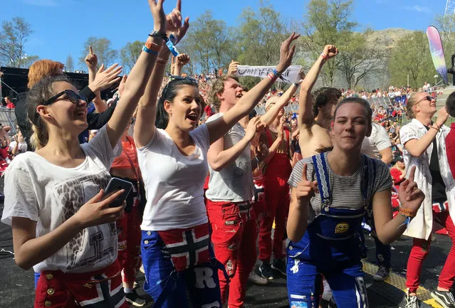 In this photo taken May 6, 2017, teenagers dance and celebrate the end of their classes, in Aalgaard, Norway. “The russ” teenagers on the verge of graduating from Norway’s high schools, start partying when classes end in the middle of April and lasts until Norwegian National Day on May 17. Exams begin shortly afterward. (Photo by Mark Lewis/AP Photo)