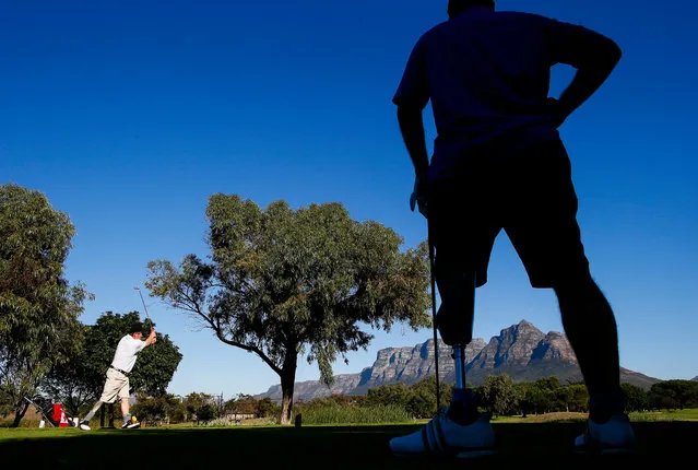 Single leg amputee Reinard Friske from Germany (L) Tees off during the World Disabled Golf Championship at King David Mowbray Golf Club, Cape Town, South Africa 15 May 2017. The World Disabled Golf Championship runs concurrently with the Canon South African Disabled Golf Open with more than 80 competitors from twelve nations competing. People suffering from any number of physical disabilities including arm and leg amputees, hemiplegics, paraplegics, stroke victims, blind and deaf people that are able to grip the club with at least one hand and hit the ball can compete. (Photo by Nic Bothma/EPA)