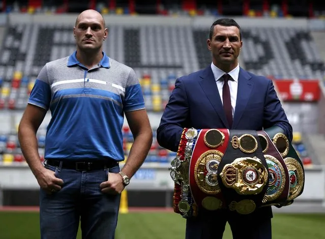 Ukrainian boxer Vladimir Klitschko and British boxer Tyson Fury (L) pose during a news conference in Duesseldorf, Germany July 21, 2015. Unbeaten Fury will get a shot at the world heavyweight title in October after agreeing terms for a meeting with champion Klitschko. (Photo by Ina Fassbender/Reuters)