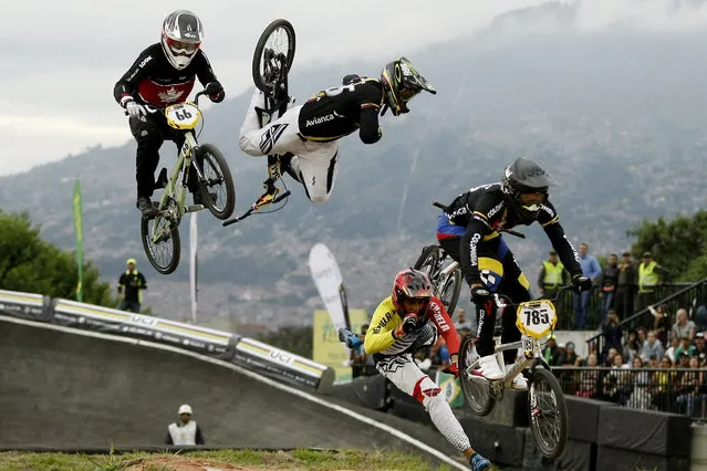 Carlos Mario Oquendo of Colombia (2-L, up) falls along Jefferson Milano of Venezuela (2-R, bottom), during the finals of the elite men's World UCI BMX Championship in Medellin, Colombia, 29 May 2016. (Photo by Luis Eduardo Noriega/EPA)