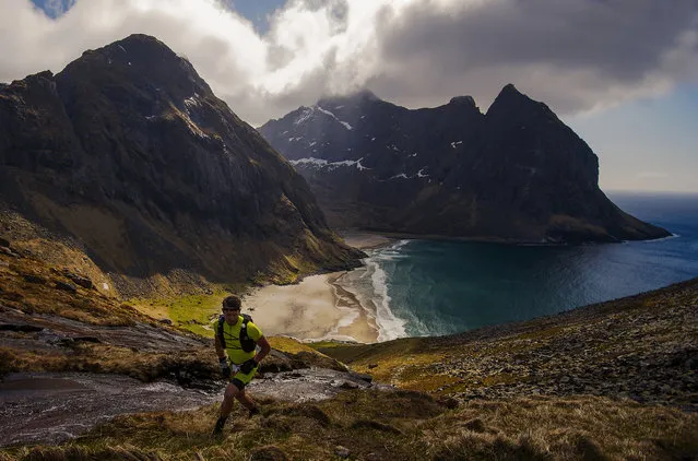An athlete climbing up from Kvalvika beach at The Arctic Triple – Lofoten Ultra on June 3, 2017 in Svolvar, Norway. The Arctic Triple – Lofoten Ultra is the second of three races. The others are Lofoten Skimo and Lofoten Triathlon (Photo by Kai-Otto Melau/Getty Images)