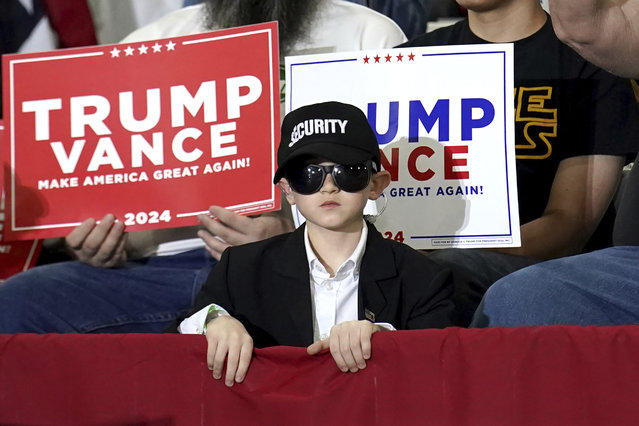 A young attendee listens as Republican vice presidential nominee Sen. JD Vance, R-Ohio, speaks at a campaign event at JWF Industries, Saturday, October 12, 2024, in Johnstown, Pa. (Photo by Matt Freed/AP Photo)