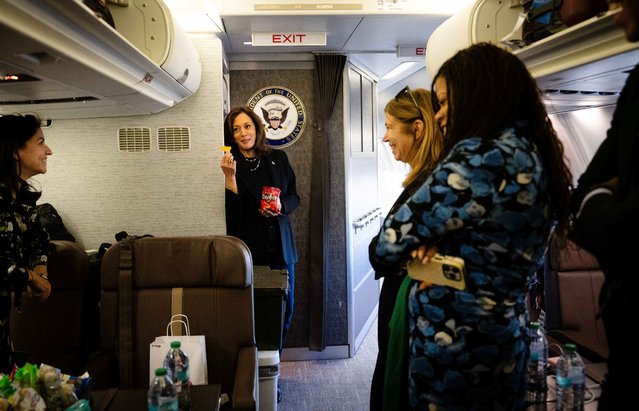 Kamala Harris eats Doritos and thanks senior staff for a great day aboard Air Force Two in Philadelphia on October 27, 2024. (Photo by Erin Schaff/Reuters)