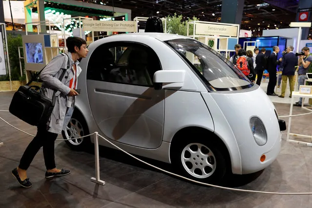 A visitor looks at a self-driving car by Google at the Viva Technology event in Paris, France, June 30, 2016. (Photo by Benoit Tessier/Reuters)