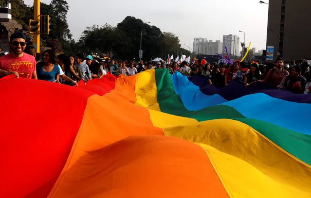 Participants march during the annual Gay Pride parade in Lima, Peru on July 2, 2016. (Photo by Guadalupe Pardo/Reuters)