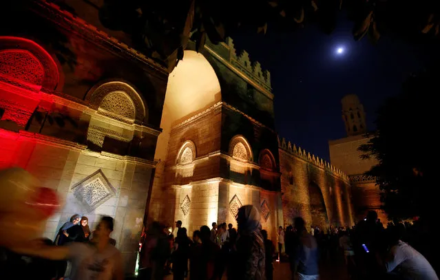 People celebrate after their iftar (breaking fast) meal during the Muslim fasting month of Ramadan in front of Al-Hakim bi-Amr Allah Mosque, in old Cairo, Egypt June 16, 2016. (Photo by Amr Abdallah Dalsh/Reuters)