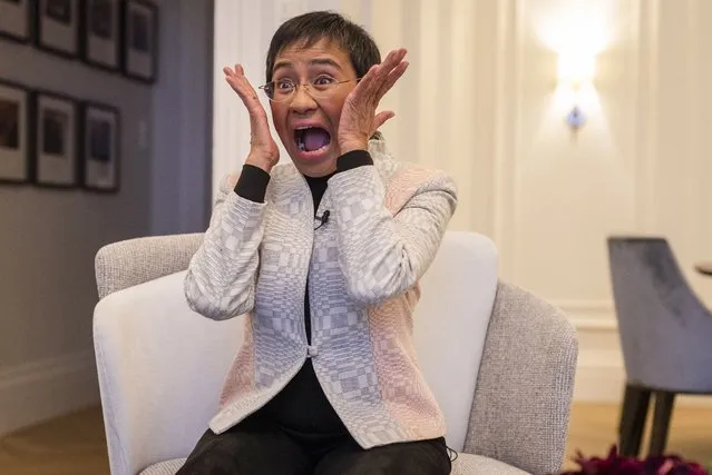 Nobel Peace Prize laureate Maria Ressa of the Philippines immitates the painting “Scream” by Norwegian painter Edvard Munch when asked about how she reacted to winning the award, during an AFP interview prior to the award ceremony in Oslo, on December 10, 2021 (Photo by Odd Andersen/AFP Photo)