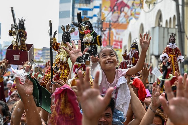Catholic devotees take part in a procession during the blessing of the Black Nazarene replicas outside the Quiapo Church in Manila on January 2, 2025, ahead of its annual feast day on January 9. (Photo by Jam Sta Rosa/AFP Photo)