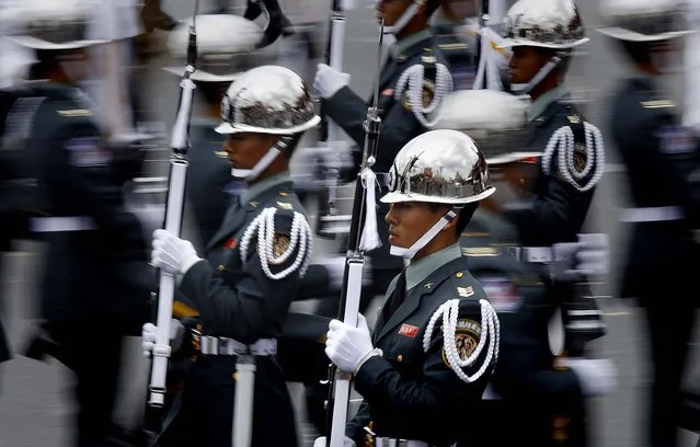 Military honor guard march during National Day celebrations marking the 101st anniversary of the founding of the Republic of China, in front of the Presidential Office in Taipei, Taiwan, on October 10, 2012. (Photo by Wally Santana/Associated Press)
