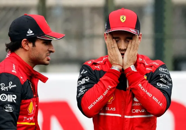 Carlos Sainz of Ferrari and Spain chats with Charles Leclerc of Ferrari and Monaco during qualifying ahead of the F1 Grand Prix of Japan at Suzuka International Racing Course on October 08, 2022 in Suzuka, Japan. (Photo by Issei Kato/Reuters)