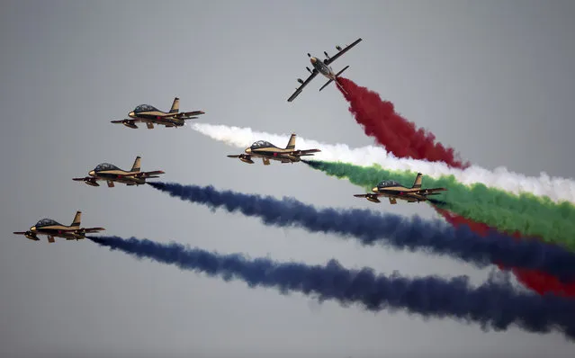 Al Fursan, or the Knights, a UAE Air Force aerobatic display team, perform on the second day of the Dubai Air Show, United Arab Emirates, Monday, November 13, 2017. (Photo by Kamran Jebreili/AP Photo)