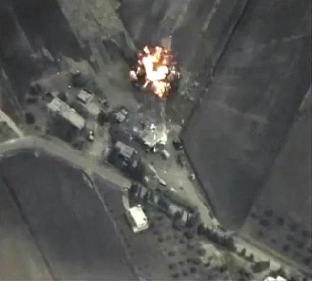 A frame grab taken from footage released by Russia's Defence Ministry September 30, 2015, shows precise airstrikes carried out by the country's air force on Wednesday, against Islamic State (IS) ground positions in a mountainous area in Syria. Russian air strikes in Syria are targeting a list of well-known militant organisations, not only Islamic State, the Kremlin said on Thursday, a day after the launch of its aerial campaign opened up a volatile new phase in the conflict. (Photo by Reuters/Ministry of Defence of the Russian Federation)