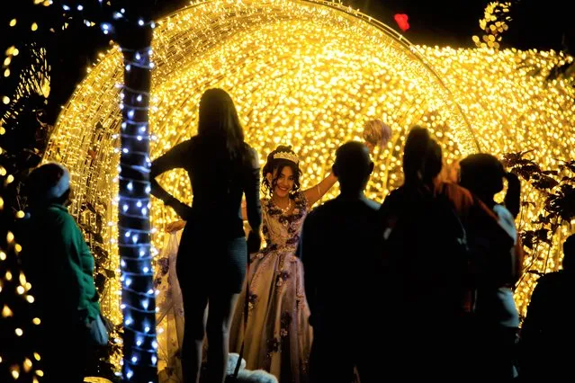 People view Christmas decorations and preparations for the December holidays in Caracas, Venezuela on December 1, 2022. (Photo by Miguel Gutierrez/EPA/EFE)