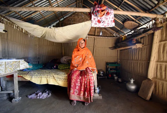 Marzina Bibi, 26, who said she was detained last year on suspicion of being an illegal immigrant from Bangladesh, poses inside her house in Fofonga village in Goalpara district in the northeastern state of Assam, India, January 2, 2018. (Photo by Anuwar Hazarika/Reuters)