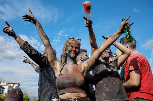 Revellers participate in a colourful “flour war”, celebrating the “Ash Monday” or “Clean Monday”, a traditional festivity marking the end of the carnival season and the start of the 40-day Lent period until the Orthodox Easter, in the town of Galaxidi, Greece, on March 18, 2024. (Photo by Louisa Gouliamaki/Reuters)