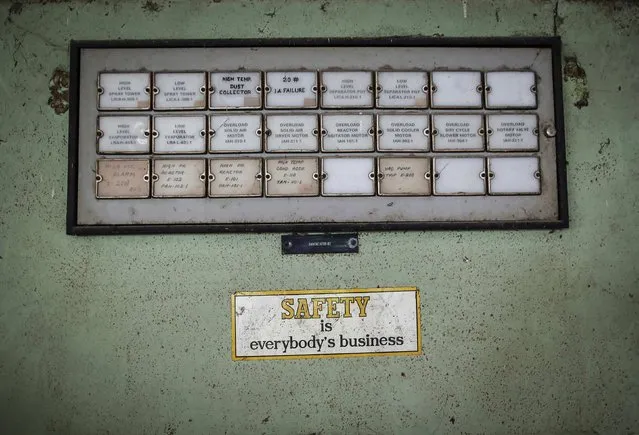 A sticker is seen next to a panel in the control room of the abandoned former Union Carbide Corp pesticide plant in Bhopal November 14, 2014. (Photo by Danish Siddiqui/Reuters)