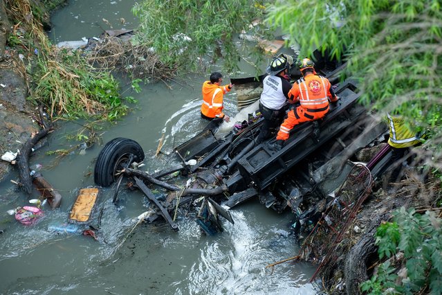First responders work at the site of a deadly bus crash, in Guatemala City, Guatemala, on February 10, 2025. (Photo by Josue Decavele/Reuters)